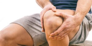 Man with knee pain in Colorado Springs requiring cartilage restoration