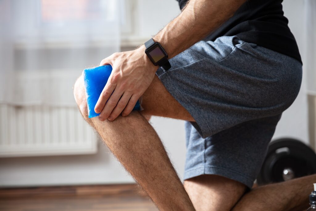 Exploring Recovery: Can a Torn Meniscus Heal on Its Own Without Surgery? Man ices his knee because of pain during his exercise.